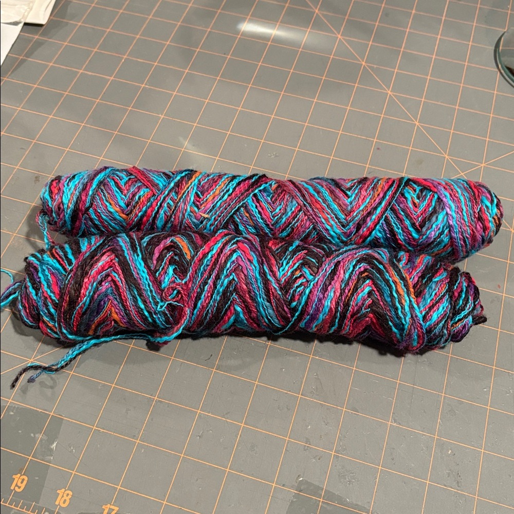 2 skeins 3 ply jewel tone yarn